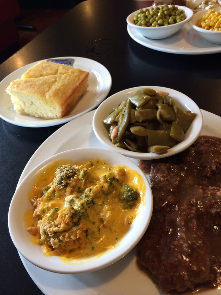 Steak dinner with green beans, broccoli casserole and cornbread